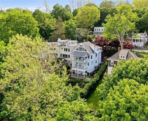 a view of a house with a yard and garden