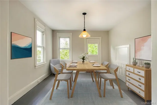 a view of a dining room with furniture and window