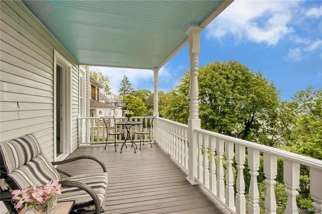 a view of balcony with furniture