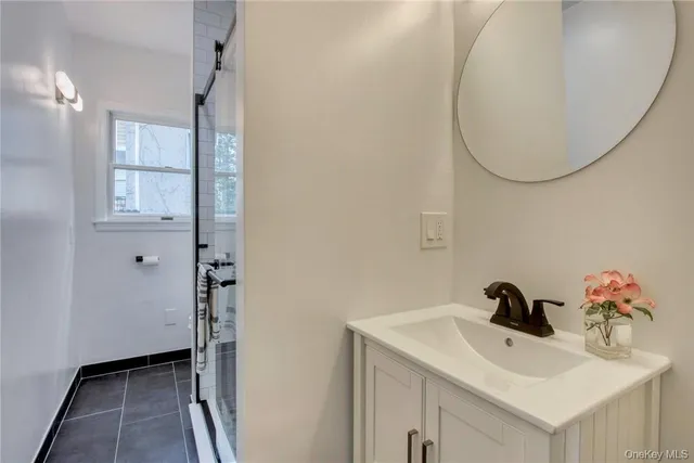 a bathroom with a sink and a mirror