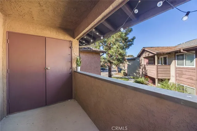 a view of a house with a potted plant