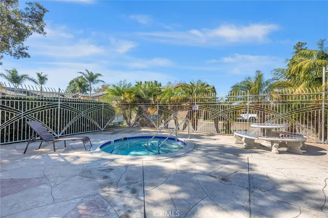 a view of a swimming pool with a yard