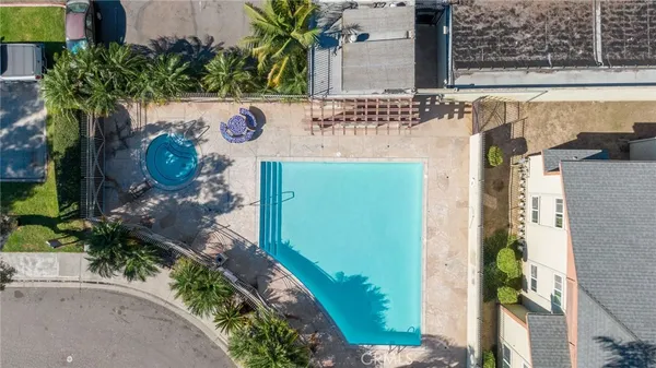 a view of a swimming pool with a patio