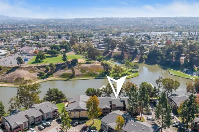 an aerial view of a house with a lake view