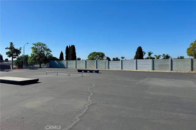 an aerial view of a house with a yard and lake