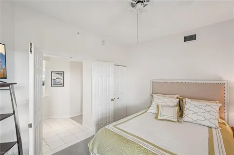 a bedroom with a bed and a table