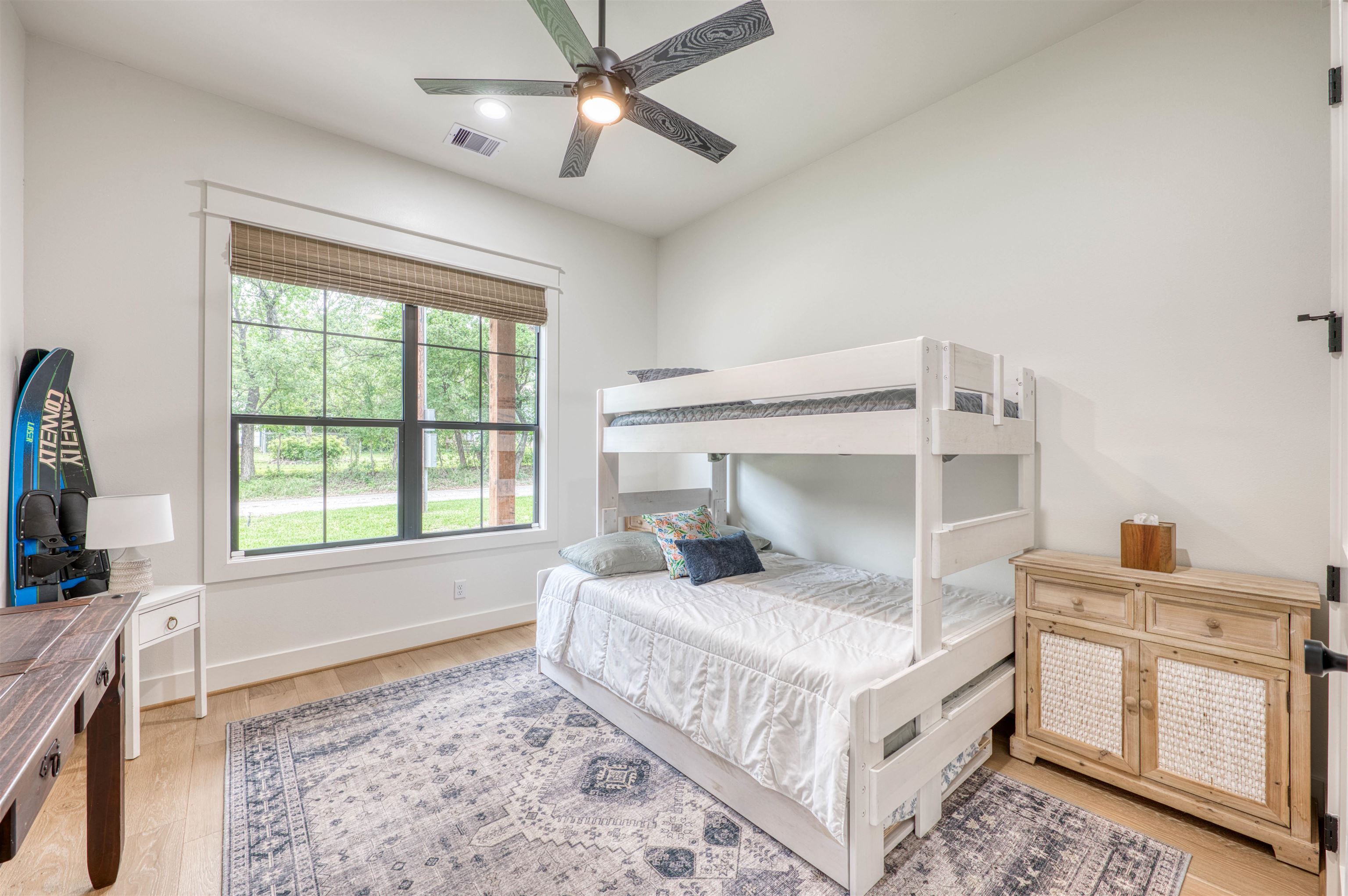 2001 Granite Cove Road Kingsland, TX 78639 - Photo 19 of 42 a bedroom with a bed chandelier and a window