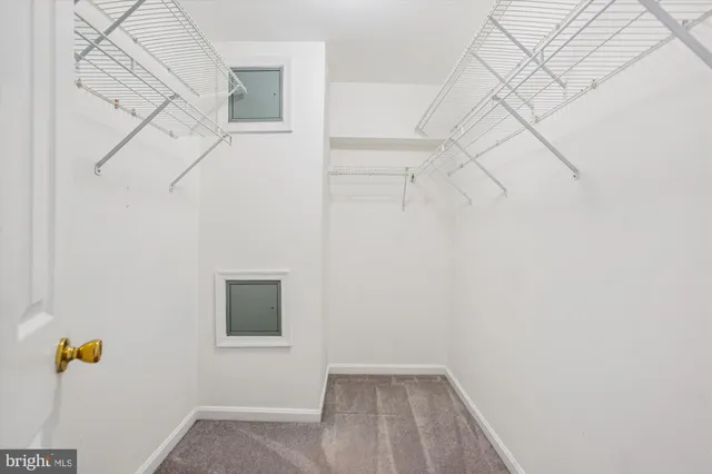 a view of small space with empty racks on the wall