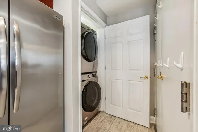 a view of a hallway with washer and dryer