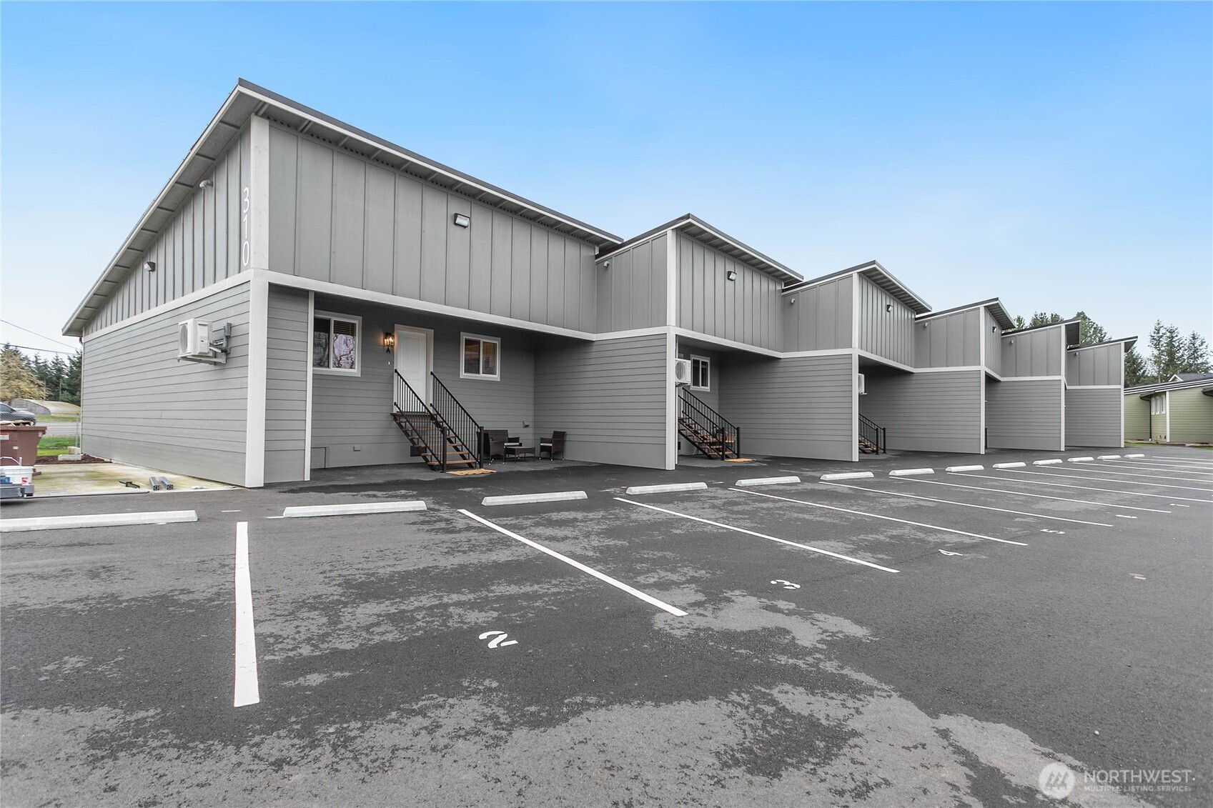 310 Everson Road, Unit C Everson, WA 98247 - Photo 2 of 37 a front view of a house with a road