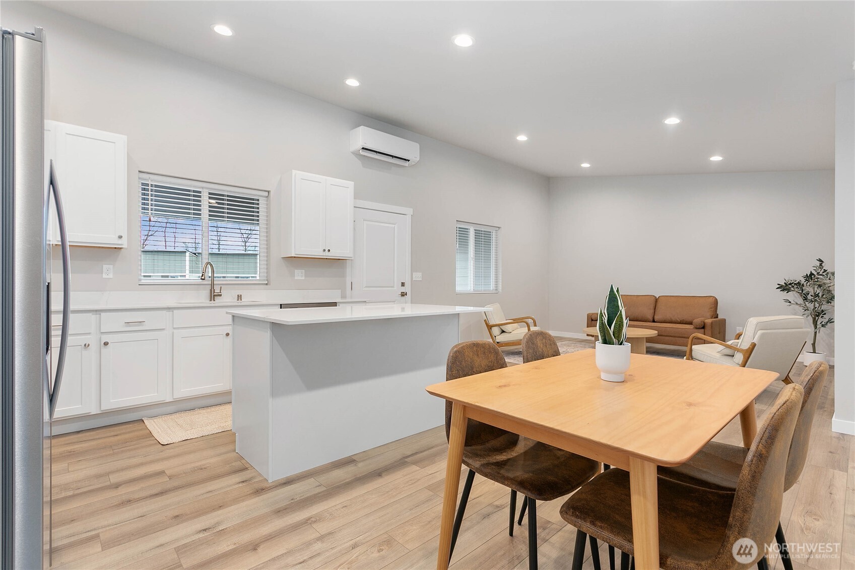 310 Everson Road, Unit C Everson, WA 98247 - Photo 21 of 37 a kitchen with a table chairs sink and cabinets