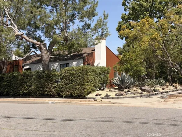 a view of a house with a tree park