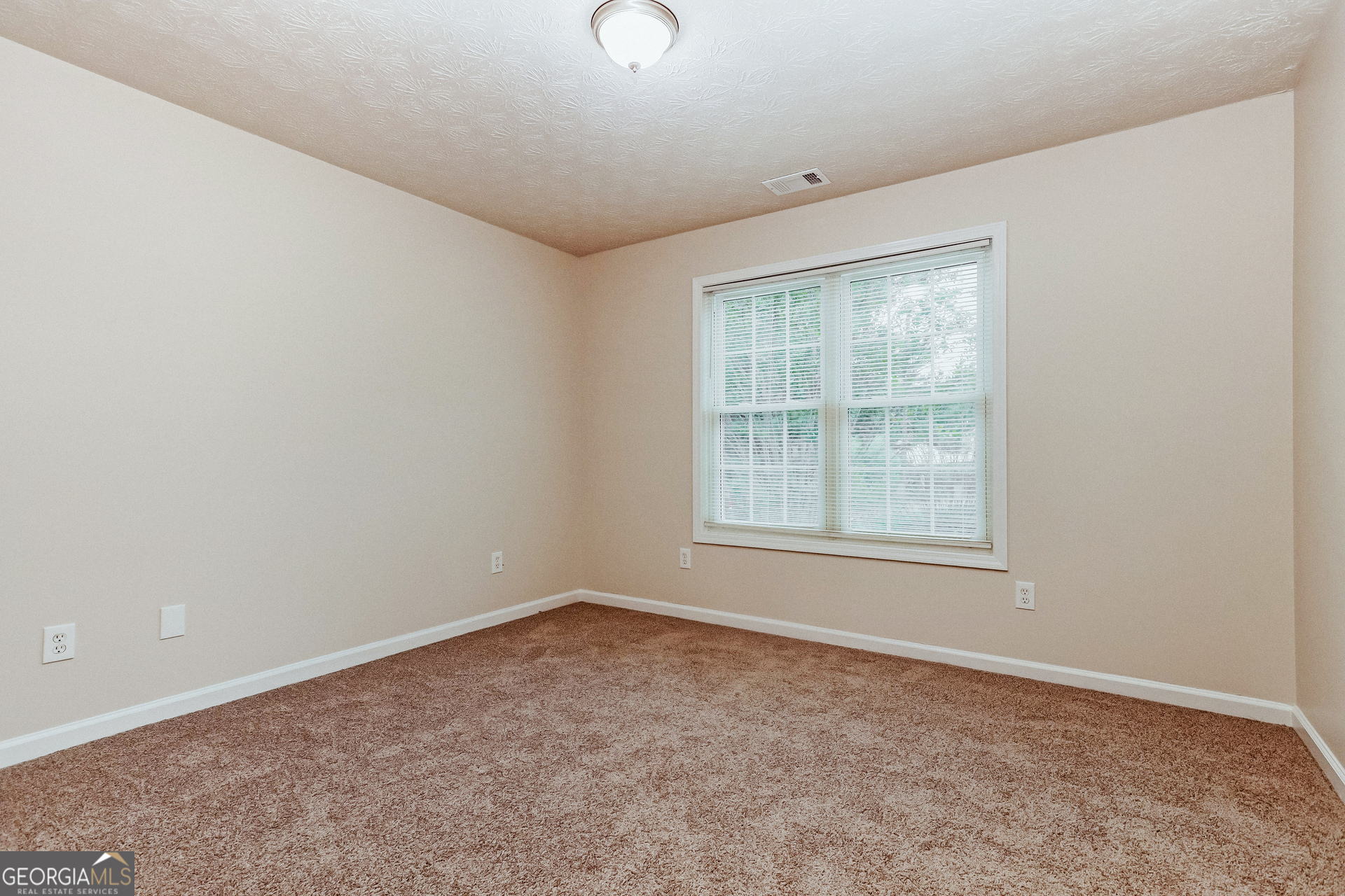 35 Spring Valley Keep Covington, GA 30016 - Photo 13 of 16 an empty room with a window