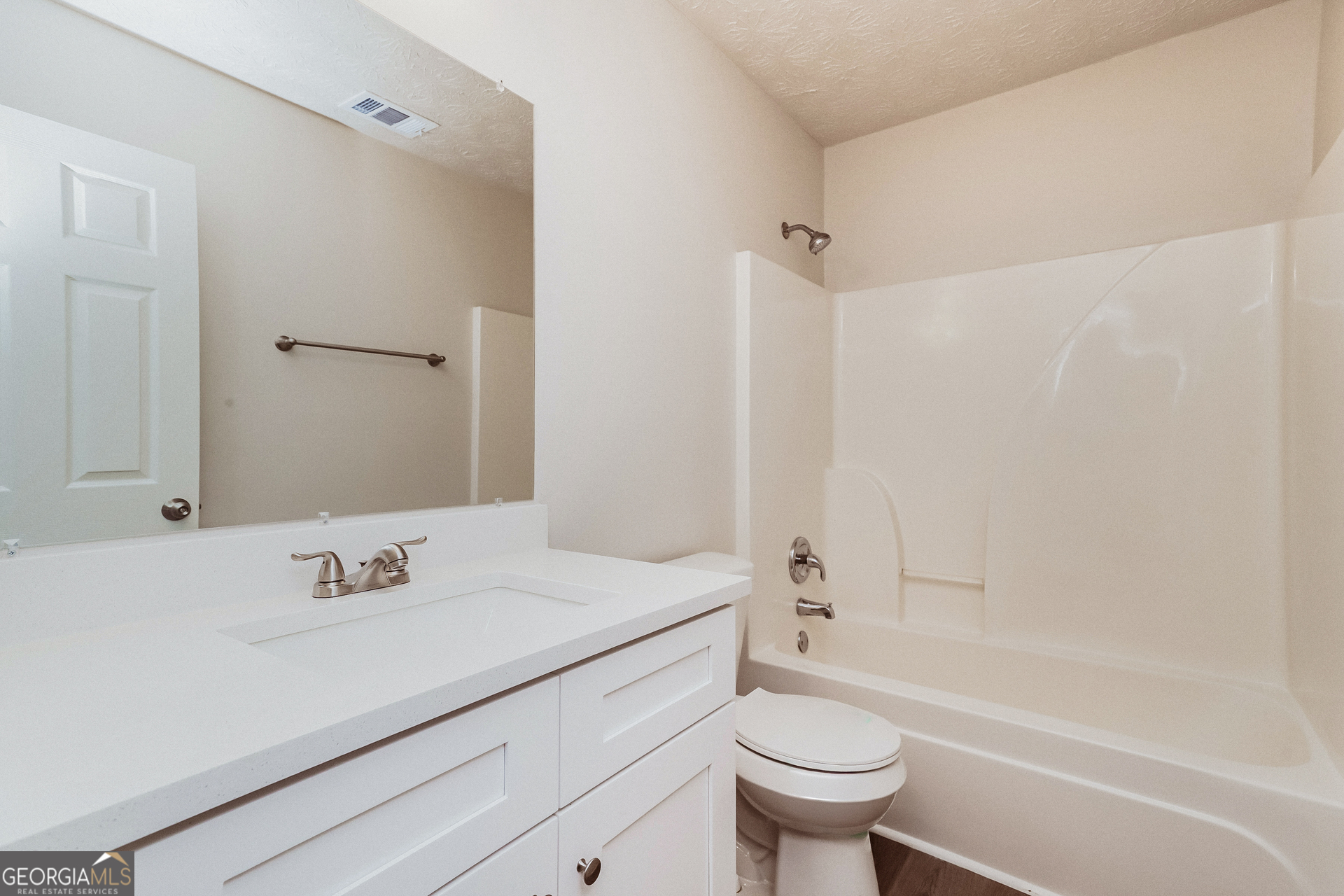 35 Spring Valley Keep Covington, GA 30016 - Photo 14 of 16 a bathroom with a sink a toilet and a mirror