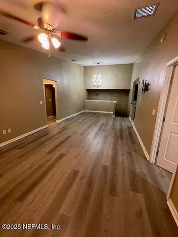 a view of a livingroom with wooden floor