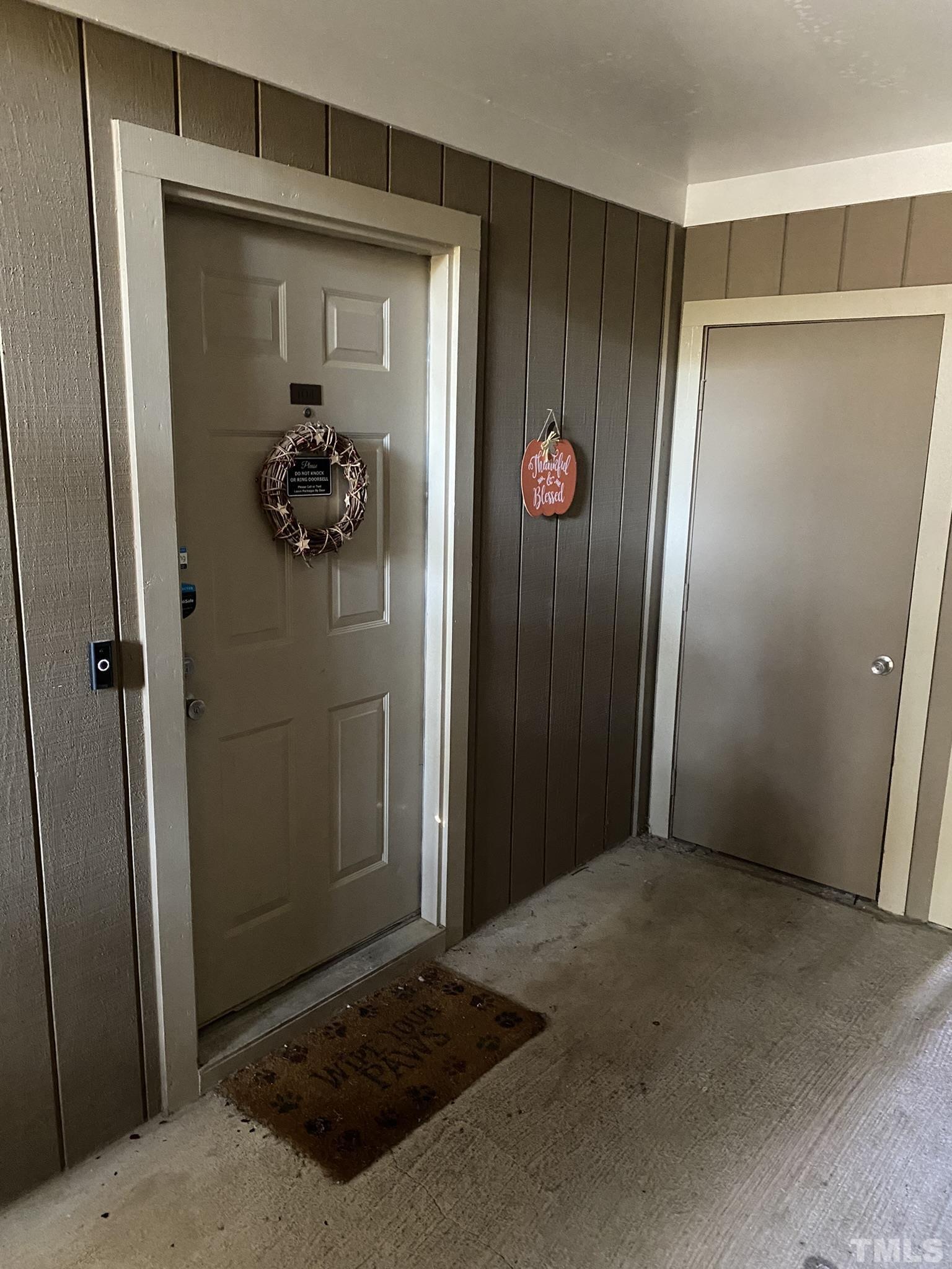 3700 Chimney Ridge Place, Unit 104 Durham, NC 27713 - Photo 4 of 17 a view of a door and wooden door