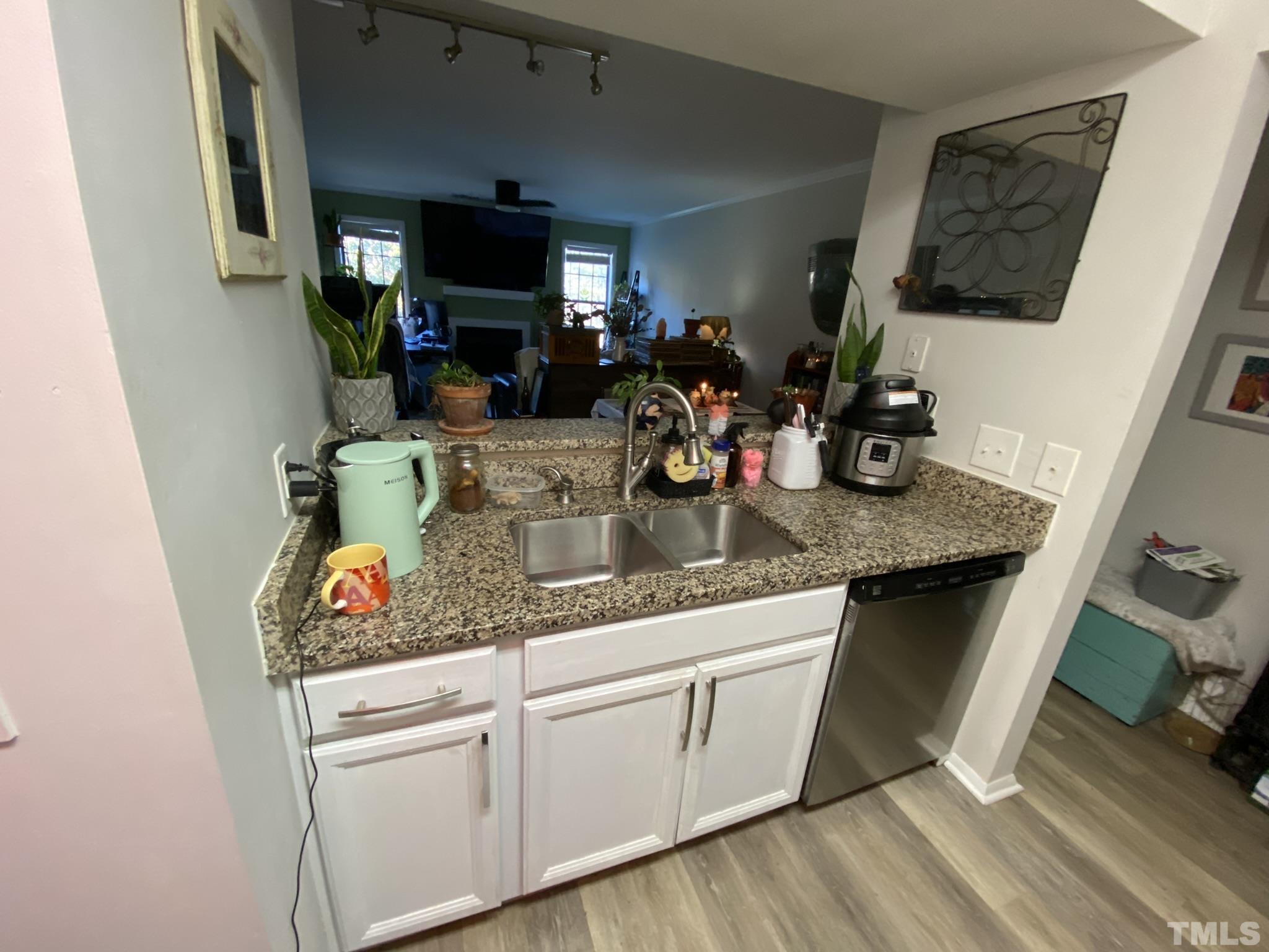 3700 Chimney Ridge Place, Unit 104 Durham, NC 27713 - Photo 6 of 17 a kitchen with sink and a refrigerator