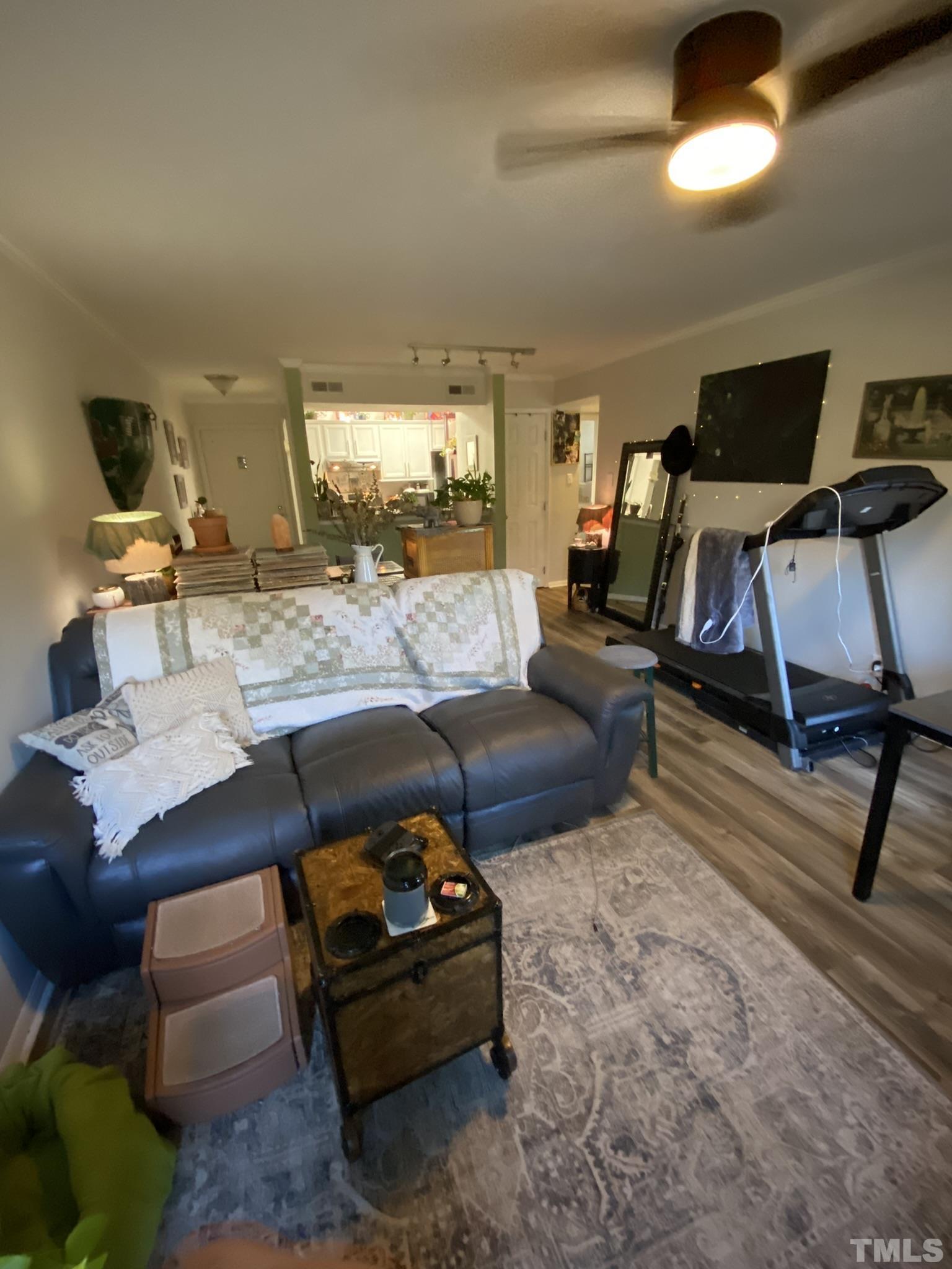 3700 Chimney Ridge Place, Unit 104 Durham, NC 27713 - Photo 9 of 17 a living room with furniture and a flat screen tv
