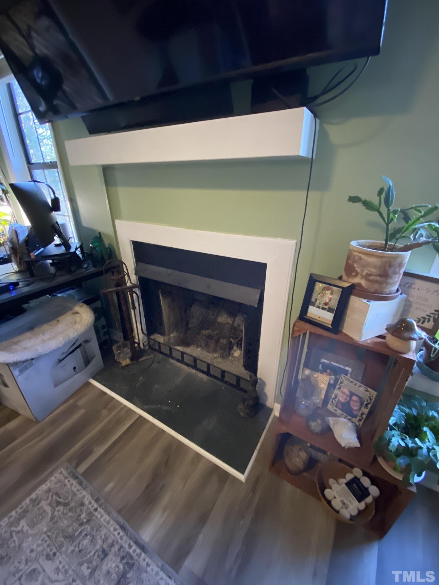 3700 Chimney Ridge Place, Unit 104 Durham, NC 27713 - Photo 10 of 17 a room with furniture and a fireplace