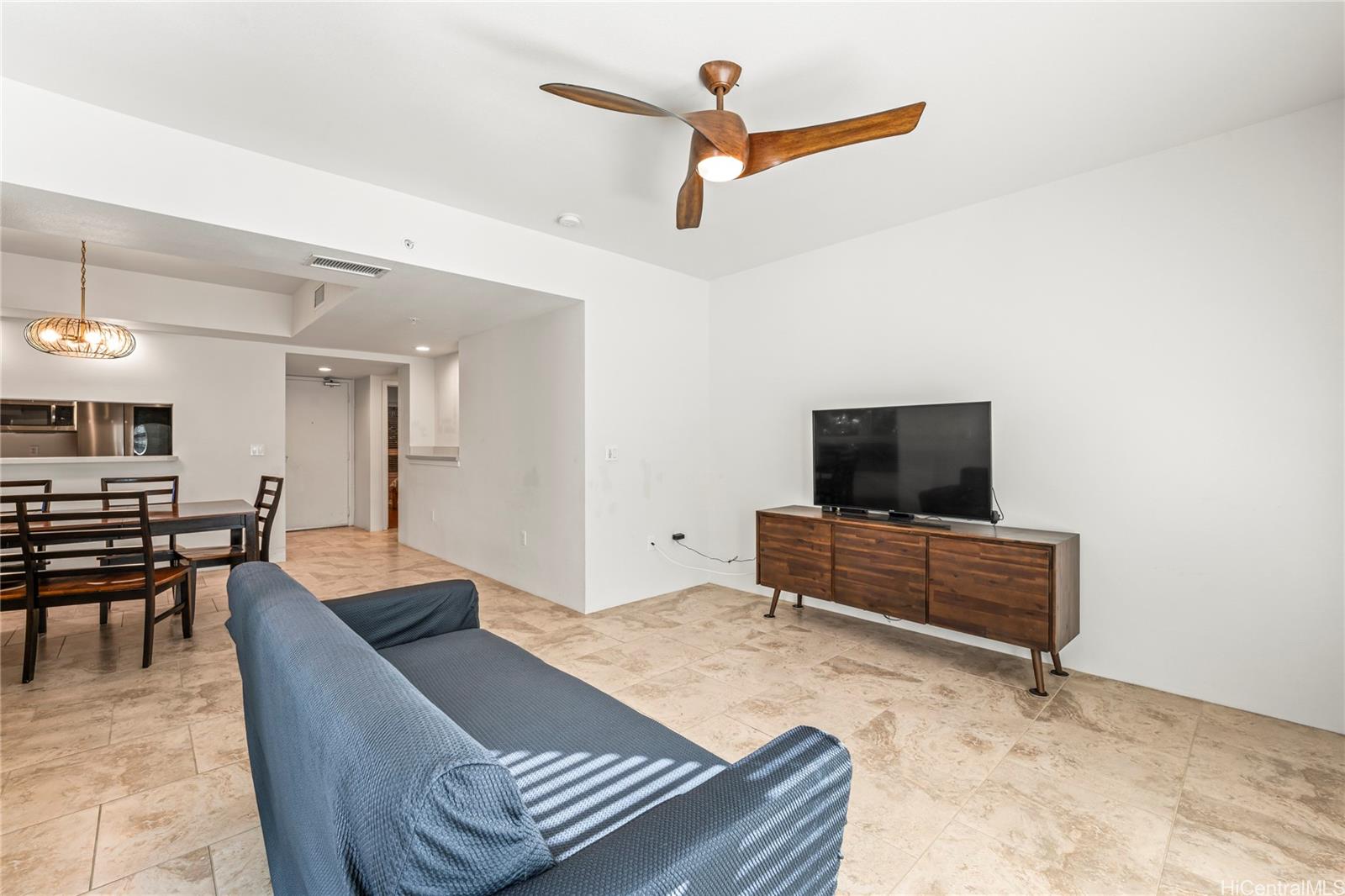 437 Kailua Road, Unit 6102 Kailua, HI 96734 - Photo 11 of 22 a living room with furniture and a flat screen tv