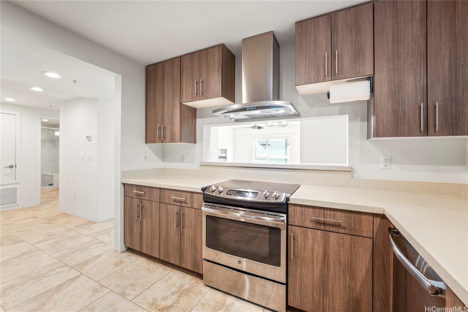 437 Kailua Road, Unit 6102 Kailua, HI 96734 - Photo 2 of 22 a kitchen with a stove and a microwave