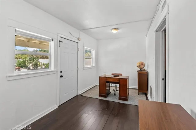a view of room with window and wooden floor
