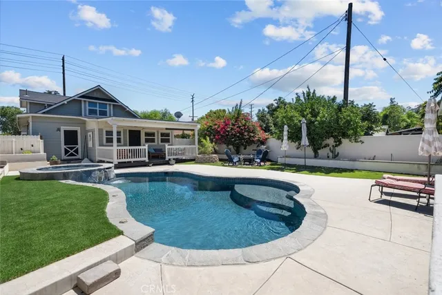 a view of a swimming pool with a patio