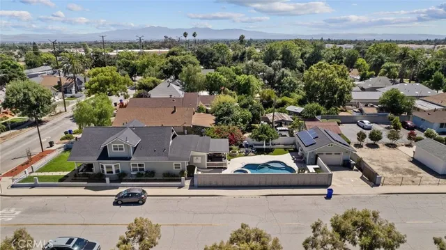 an aerial view of a houses with yard