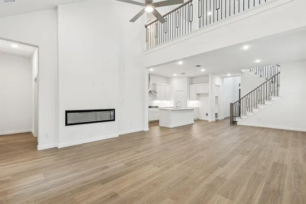 a view of a kitchen with wooden floor