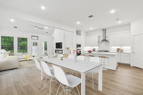 a large kitchen with kitchen island a large island in the center
