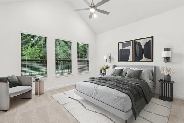 a bedroom with a bed couch and window
