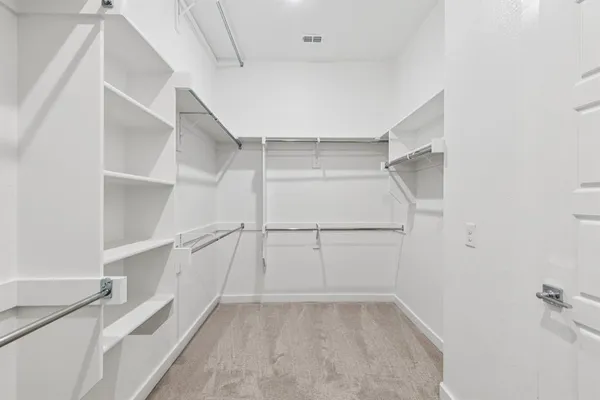 a view of an empty walk in closet