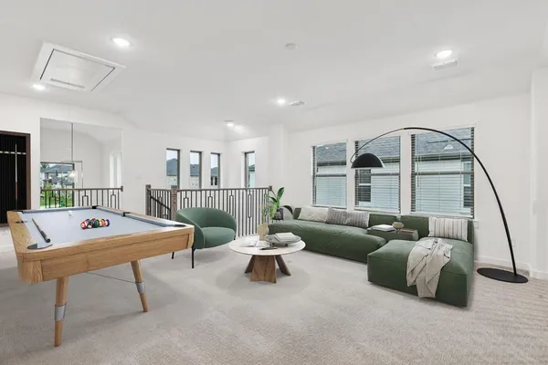 a living room with furniture a table and a large window