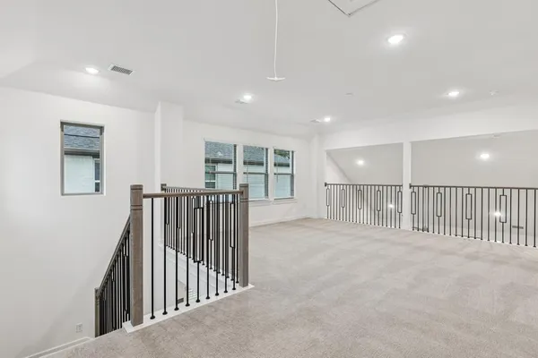 a view of an empty room with stairs
