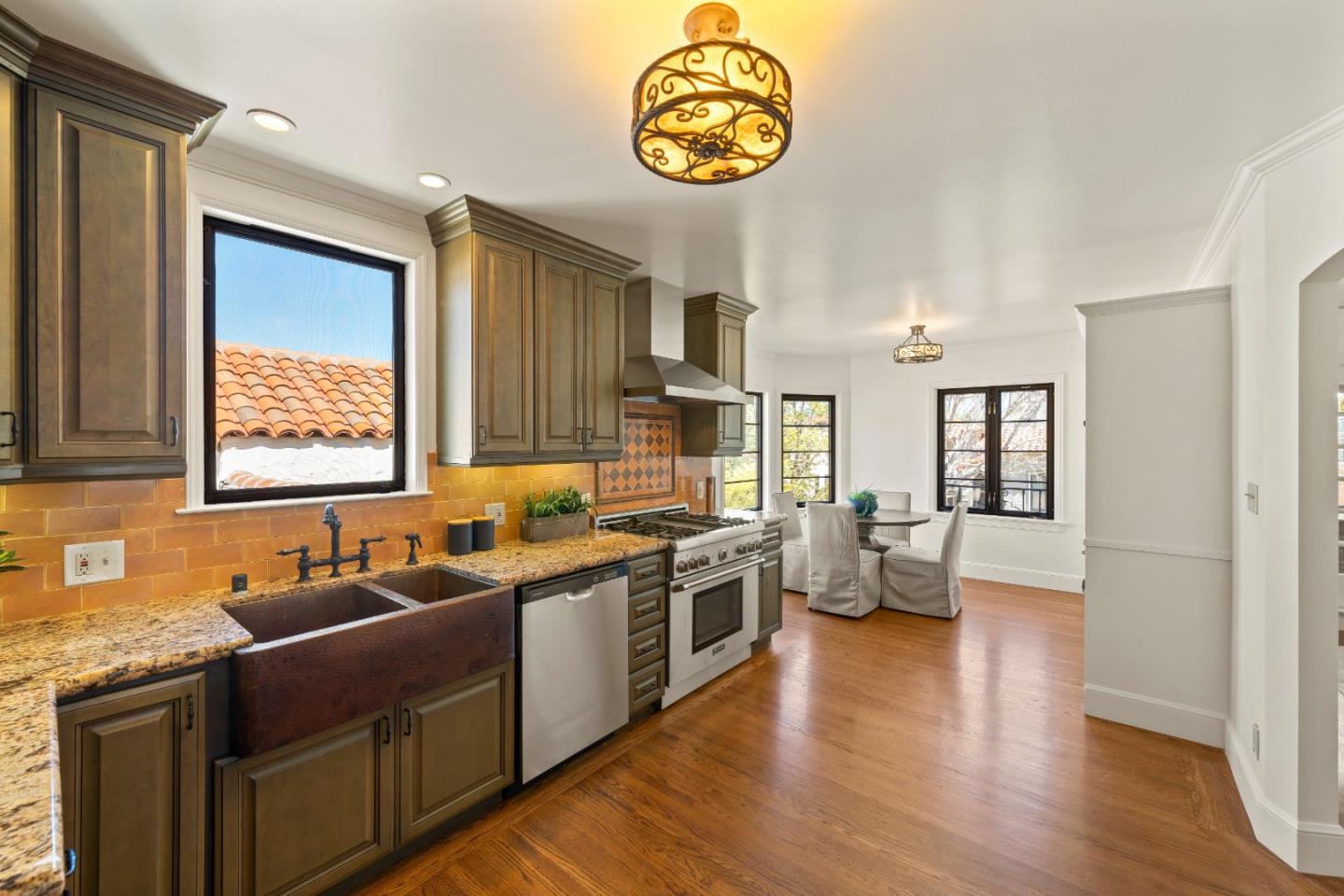 331 Elder Avenue Millbrae, CA 94030 - Photo 16 of 53 a kitchen with a sink and a stove top oven