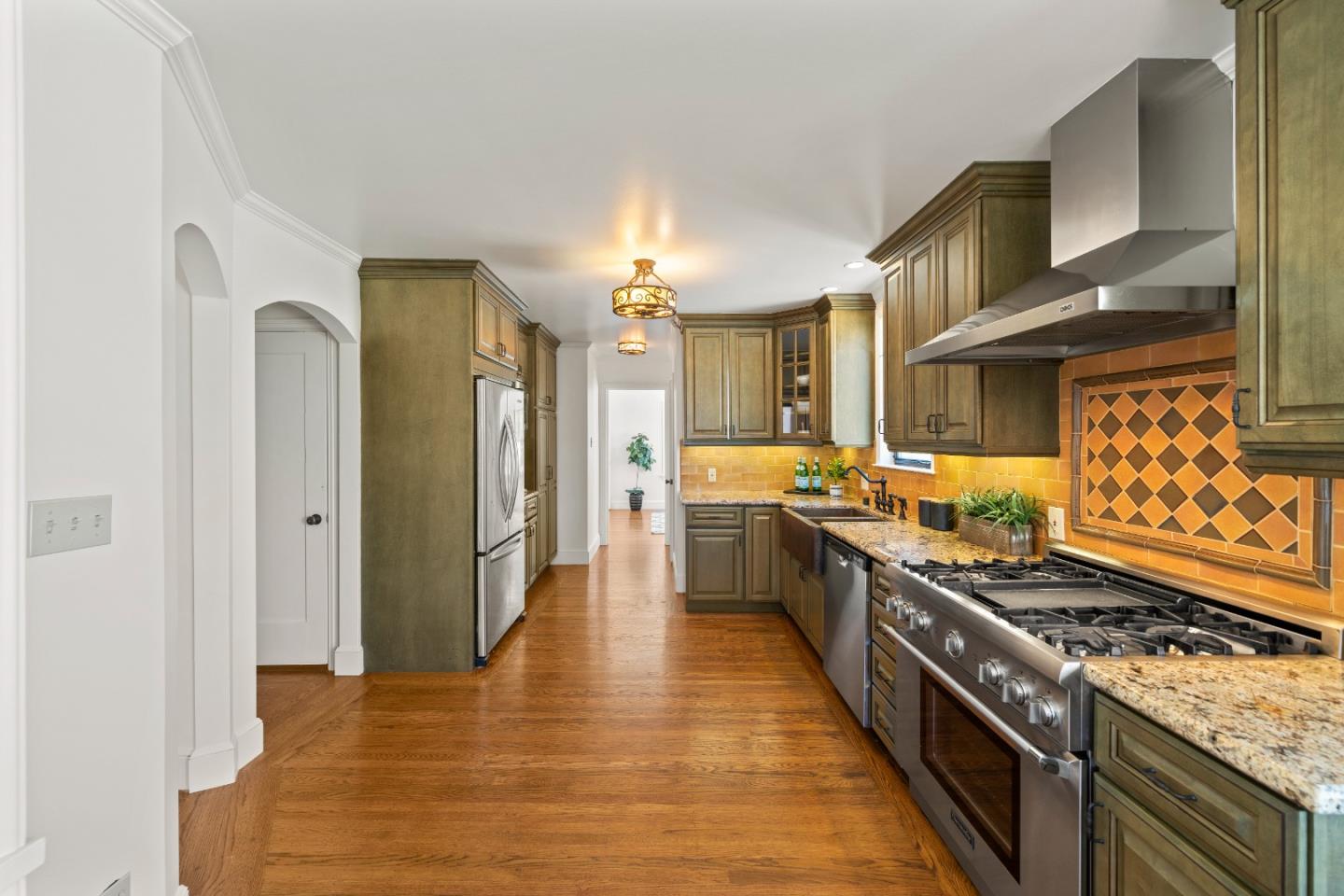 331 Elder Avenue Millbrae, CA 94030 - Photo 19 of 53 a kitchen with stainless steel appliances granite countertop a stove and a refrigerator