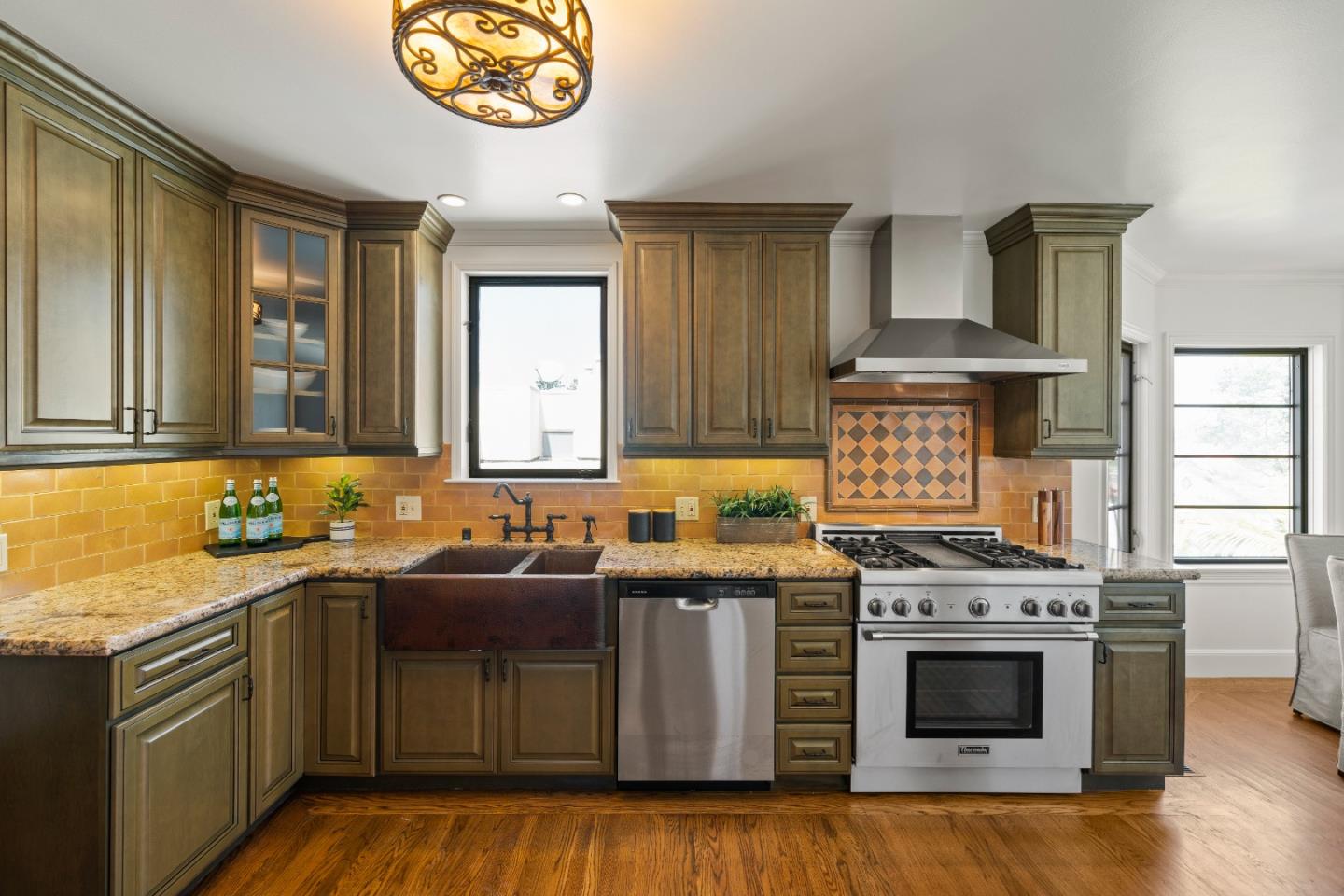 331 Elder Avenue Millbrae, CA 94030 - Photo 21 of 53 a kitchen with stainless steel appliances a stove a sink and a microwave