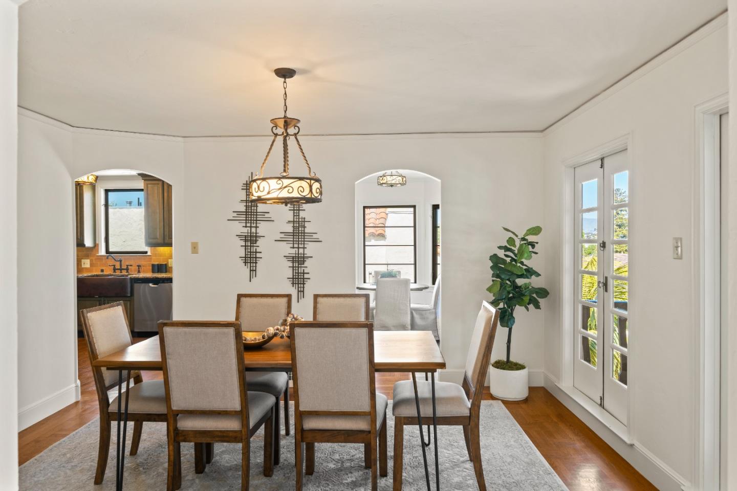 331 Elder Avenue Millbrae, CA 94030 - Photo 9 of 53 a dining room with furniture a chandelier and wooden floor