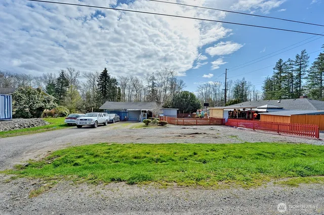 a view of outdoor space with garden and patio