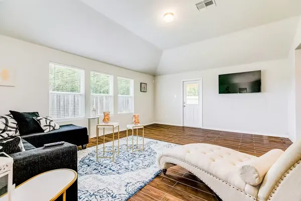 a bedroom with a bed and couch