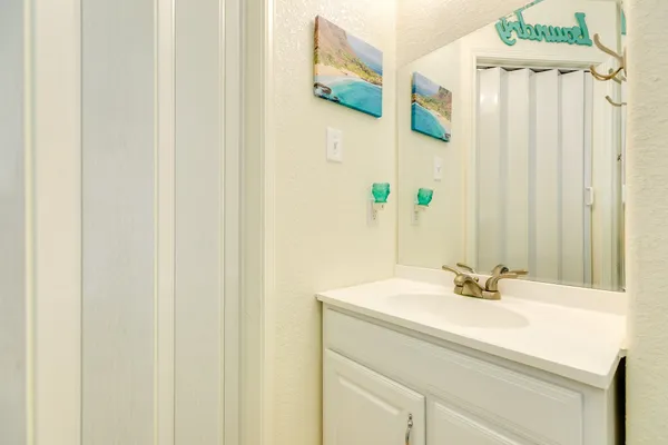 a bathroom with a sink and a mirror