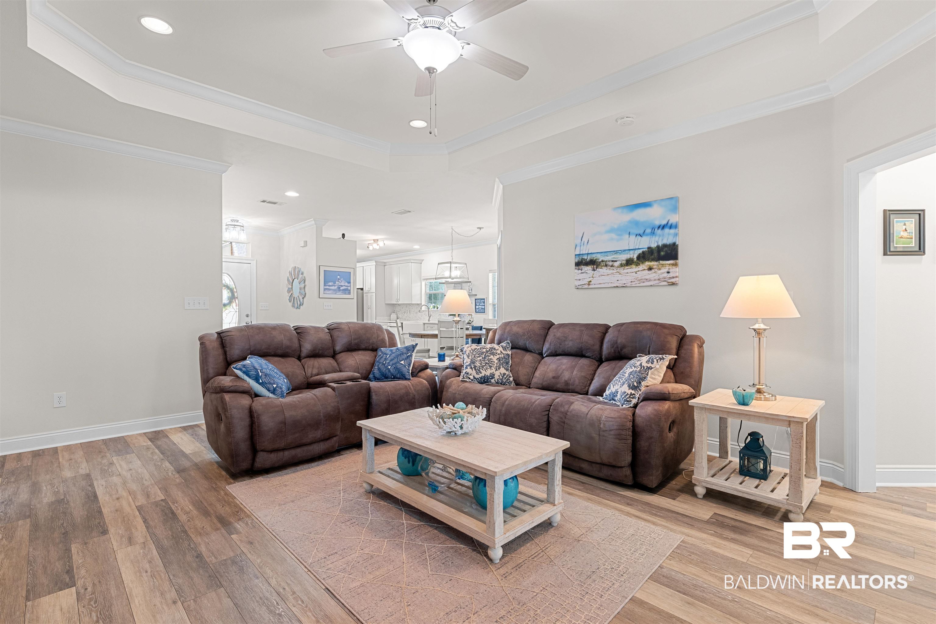 141 Mark Twain Loop Foley, AL 36535 - Photo 13 of 55 Living area featuring a tray ceiling, a ceiling fan, light wood-style floors, ornamental molding, and recessed lighting