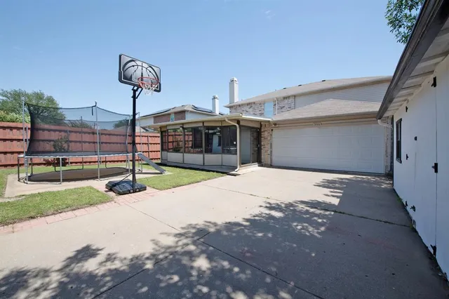 a view of a house with swimming pool and sitting area
