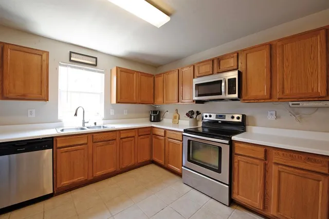 a bedroom with furniture and a book shelf