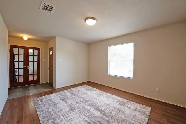 an empty room with windows and mountain view