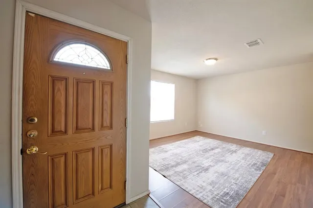 a bedroom with a bed and a mirror