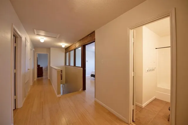 a bathroom with a double vanity sink and mirror with shower
