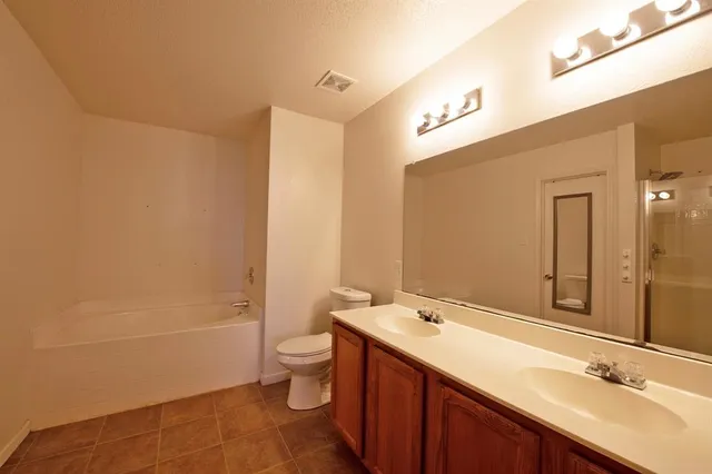 a view of a bedroom from a hallway