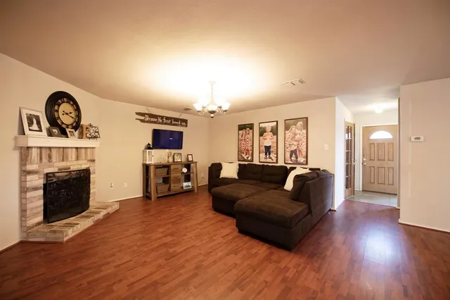 a living room with furniture and a fireplace