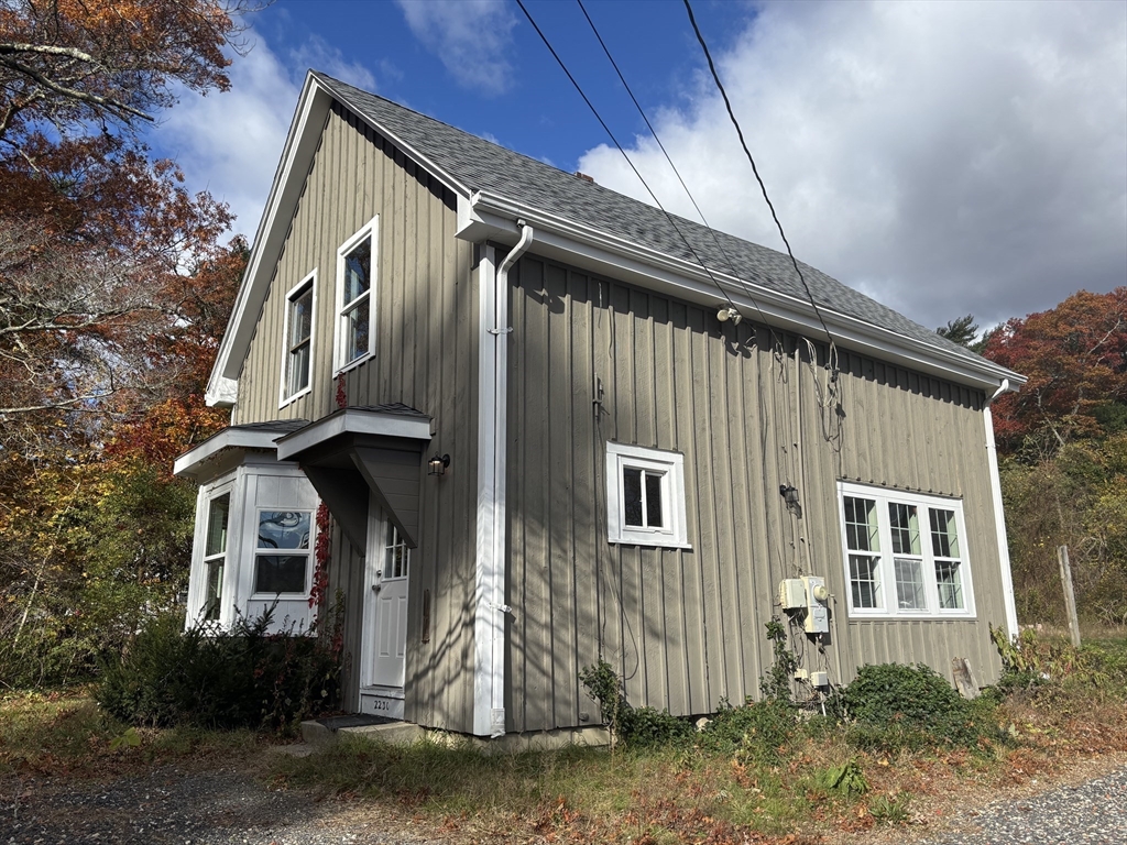 2230 Cranberry Highway, Unit A Wareham, MA 02576 - Photo 2 of 25 a front view of a house with garage